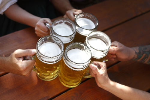 People drinking beer in a traditional Bavarian beer garden